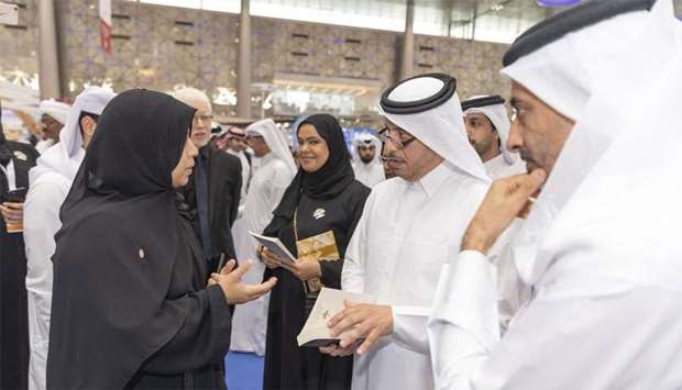 HE the Prime Minister and Minister of Interior Sheikh Abdullah bin Nasser bin Khalifa al-Thani is being briefed on the latest publications, books and manuscripts at a pavilion during his visit to the 29th Doha International Book Fair at the Doha Exhibition and Convention Centre on Saturday.