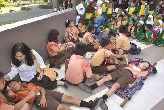 Indonesian students take part in an earthquake and tsunami drill in Banda Aceh yesterday.