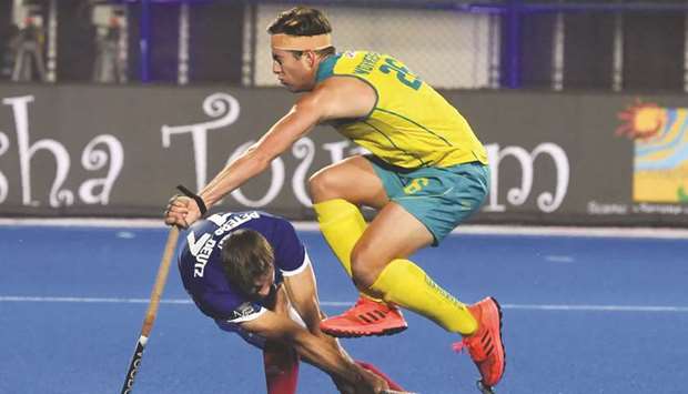 Australiau2019s Dylan Wotherspoon (right) in action with Franceu2019s Cristoforo Peters-Deutz during the 2018 Hockey World Cup quarter-final in Bhubaneswar, India, yesterday. (AFP)