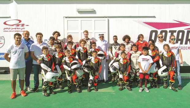 HE the Minister of Culture and Sports Salah bin Ghanem bin Nasser al-Ali with the young riders at the Qatar Motorsports Academy.