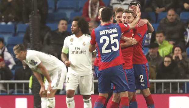 CSKA Moscowu2019s Fedor Chalov celebrates with teammates after scoring their first goal during the Champions League Group G match against Real Madrid in Madrid, Spain, yesterday. (Reuters)