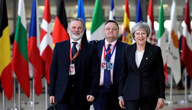 British Prime Minister Theresa May and Britain's Permanent Representative to the EU Tim Barrow arrive at a European Union leaders summit in Brussels