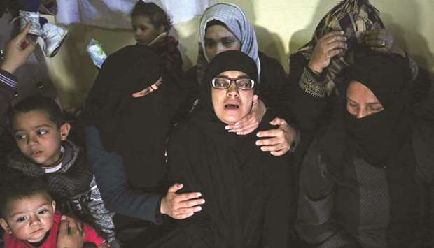 The mother of Palestinian boy Ahmed Abed cries during his  funeral in Khan Yunis in the southern Gaza Strip, yesterday.