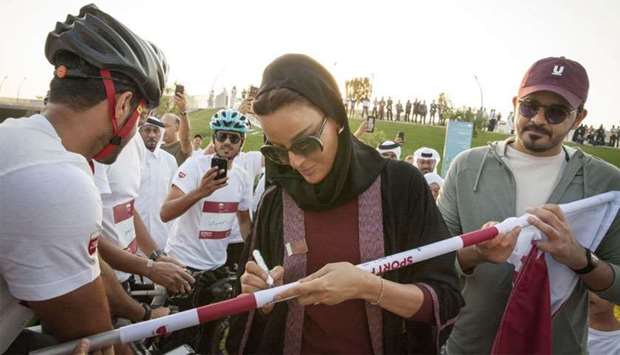 Her Highness Sheikha Moza bint Nasser, Chairperson of Qatar Foundation, joined a country-wide display of national pride and unity at Oxygen Park on Thursday by participating in the u2018Flag Relayu2019, hosted by the Qatar Olympic Committee (QOC) to celebrate Qatar National Day. Her Excellency Sheikha Hind bint Hamad Al Thani, Vice Chairperson and CEO of Qatar Foundation, and His Excellency Sheikh Joaan bin Hamad Al Thani, President of the Qatar Olympic Committee, were also in attendance.