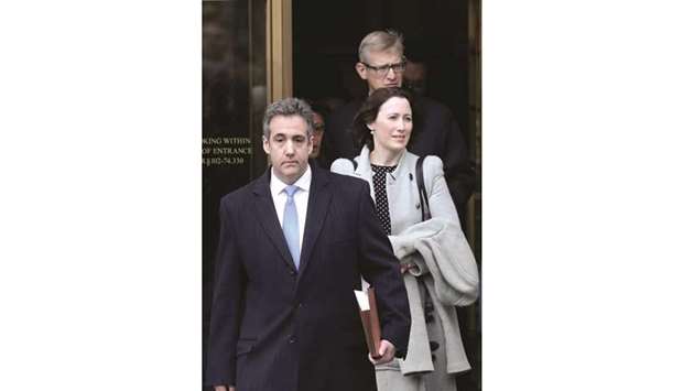 Michael Cohen exits the court house after his sentencing in New York yesterday.