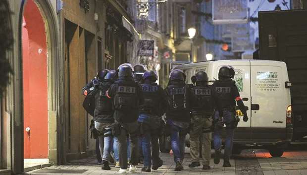 The Strasbourgu2019s BRI (Research and Intervention Brigade) patrols the streets searching for the gunman who opened fire near a Christmas market in Strasbourg.