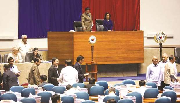 Senate President Vicente Sotto (centre-left) and House of Representatives Speaker Gloria Macapagal Arroyo (centre-right) preside over the joint session at the Philippine Congress in Quezon City, yesterday.