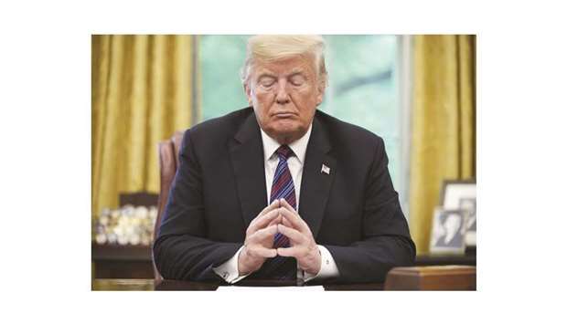 US President Donald Trump listens during a phone conversation in the Oval Office of the White House in Washington, DC in the August 27 file picture.