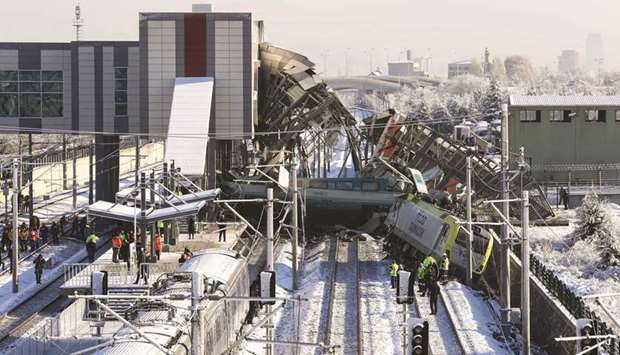 Firefighters and medics are seen at the scene of the train crash in Ankara.