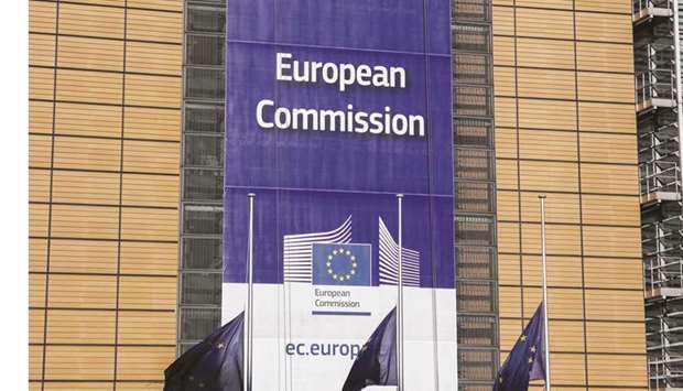 EU flags fly at half-mast outside the headquarters of the European Union in Brussels yesterday.