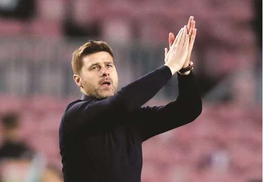 Tottenham manager Mauricio Pochettino applauds their fans after Champions League match against Barcelona at Camp Nou, Barcelona, on Tuesday. (Reuters)