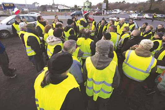 Protesters wear yellow vests as they demonstrate in Langon, near Bordeaux, France, on 11 December. The u2018Yellow Vestsu2019 or u2018Gilets Jaunesu2019 protests have been raging across France for over three weeks now.