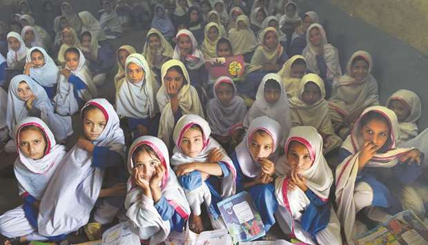 In this picture taken on September 18, girls attend a class in a school in Mingora, a town in Swat Valley. Pakistan sits on a demographic time bomb after years of exponential growth and high fertility rates resulted in a population of 207mn u2013 two-thirds of whom are under the age of 30.