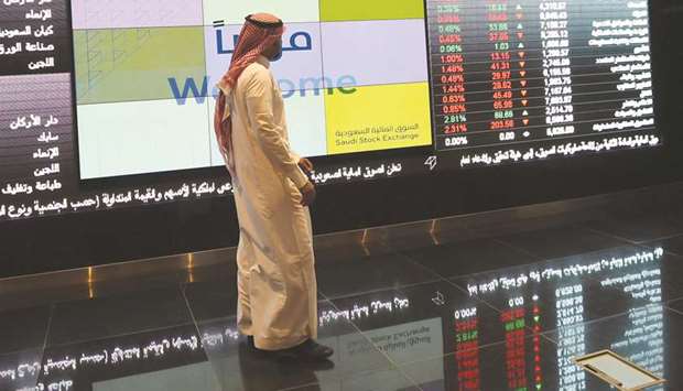 A Saudi investor monitors share prices at the Saudi Stock Exchange, or Tadawul, in the capital Riyadh (file). The euphoria surrounding Saudi Crown Prince Mohammed bin Salmanu2019s promises to reform the economy are giving way to scepticism and concern over the countryu2019s increasingly assertive and  unpredictable foreign policy.