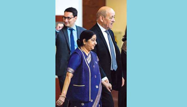 External Affairs Minister Sushma Swaraj walks out the conference room with French Foreign Minister Jean-Yves Le Drian following a joint press conference in New Delhi yesterday.