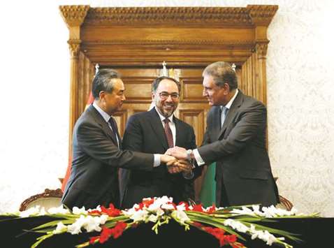 Foreign Minister Qureshi with his counterparts Wang Yi (of China) and Salahuddin Rabbani  (Afghanistan) after signing a memorandum of understanding on co-operation in fighting terrorism, in Kabul.