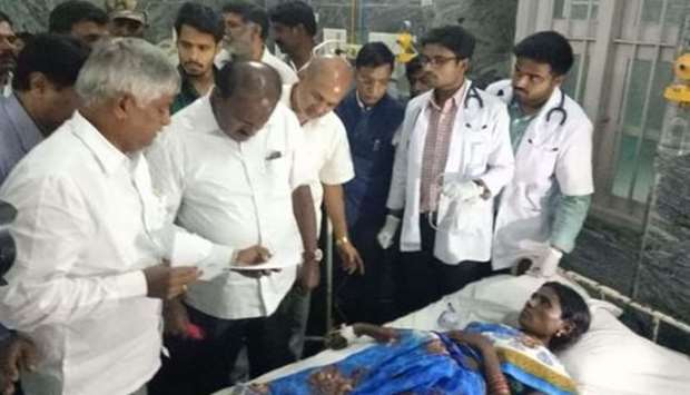 Chief minister of the Karnataka state H D Kumaraswamy visits the temple tragedy victims in KR general hospital, Mysore. Photo courtesy: Times of India