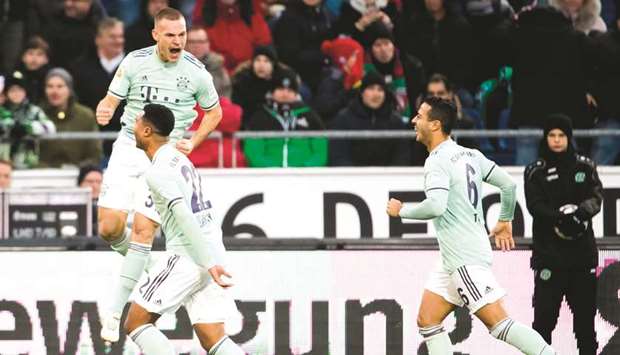 Bayern Munichu2019s Joshua Kimmich (left) celebrates his goal with teammates during the Bundesliga match against Hannover 96 in Hannover, Germany, yesterday. (AFP)