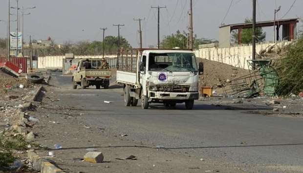 Yemeni pro-government forces steer their cars in the Houthi-held Red Sea port city of Hodeidah yesterday