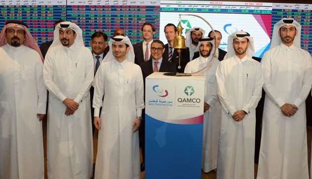 Qamco and the Qatar Stock Exchange officials after the listing. Investors expect a bullish trend.