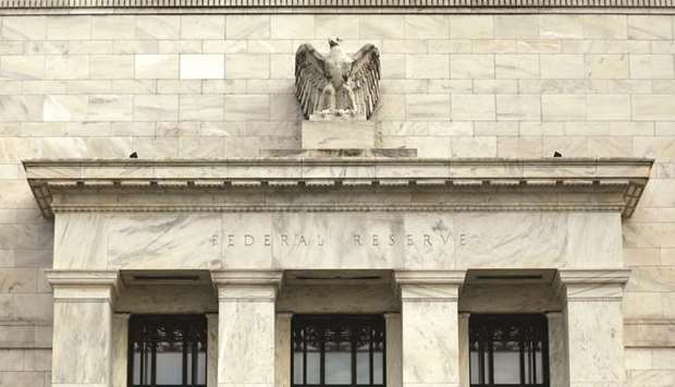 The Federal Reserve building in Washington, DC. The Fed is likely to raise interest rates in the coming week but policymakers have begun to signal they may take it a bit slower in 2019.