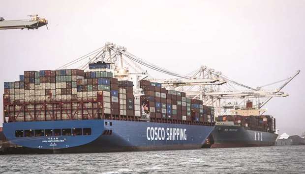 The CSCL South China Sea container ship sits docked at the Port of Oakland in California (file). Though markets are on edge and the arrest of a top Chinese executive threatened to spark a crisis, there are signs the US-China trade war can be resolved without further collateral damage to the global economy.