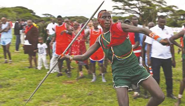 A Kenyan Maasai Moran competes as he throw a javelin, an alternative to traditional spear-throwing, yesterday during a sporting event dubbed the Maasai Olympics at Kimana, near Kenyau2019s bordertown with Tanzania.