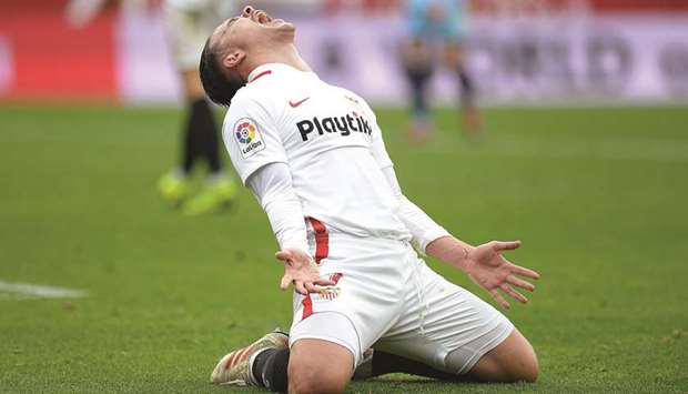 Sevillau2019s Spanish midfielder Roque Mesa reacts after missing a goal opportunity against Girona at the Ramon Sanchez Pizjuan stadium in Sevilla yesterday.