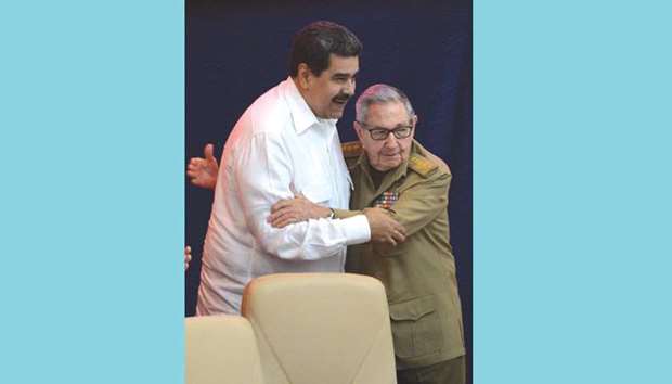 Former Cuba president Raul Castro greets Venezuelan President Nicolas Maduro at the 14th anniversary of Bolivarian Alliance for the Peoples of Our America u2013 Peoplesu2019 Trade Treaty (ALBA-TCP) during the XVI ALBA-TCP summit, at the Convention Palace in Havana.