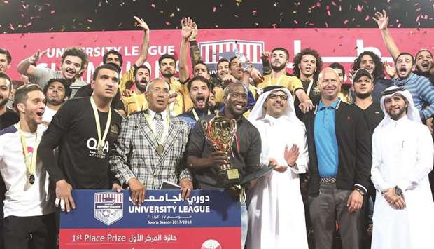 Qatar University players pose with the trophy after winning the University League.