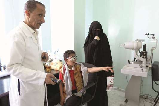 A child patient is checked by an ophthalmologist in the Yemeni capital Sanaa.