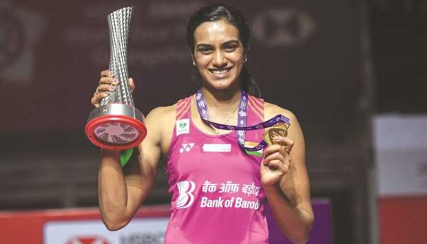 PV Sindhu of India poses with the winneru2019s trophy after winning the womenu2019s singles final at the 2018 BWF World Tour Finals in Guangzhou, China, yesterday. (AFP)