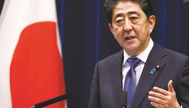 Japanese Prime Minister Shinzo Abe at a press conference in Tokyo. Abe has pledged to proceed with a twice-delayed increase in Japanu2019s sales tax rate to 10% from 8% in October next year, as part of efforts to rein in the countryu2019s burgeoning public debt.