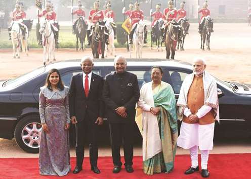 Indian Prime Minister Narendra Modi, right, Maldives President Ibrahim Mohamed Solih, second left, his wife Fazna Ahmed, left, India President Ram Nath Kovind and his wife Savita Kovind pose for a picture during ceremonial reception at the Presidential Palace in New Delhi yesterday.