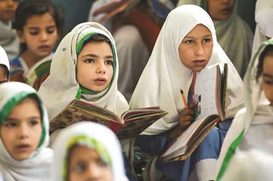This picture taken on September 18, shows girls attending a class at a school in Mingora, a town in Swat Valley of KP province, which borders the Fata region.