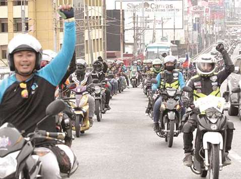 Thousands of Angkas riders hold a rally along Edsa in Quezon City to protest the decision of the Land Transportation Franchising and Regulatory Boardu2019s decision to shut down the ride hailing firmu2019s operations.