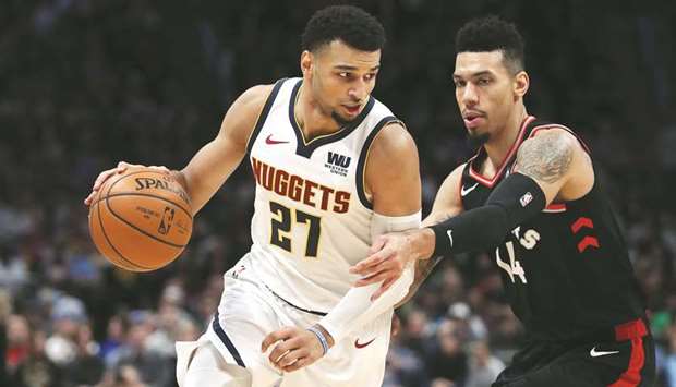 Jamal Murray of the Denver Nuggets (left) drives against Danny Green of the Toronto Raptors at the Pepsi Center in Denver, Colorado. (Getty Images/AFP)