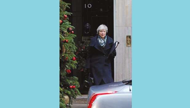 Prime Minister Theresa May leaves from 10 Downing Street in central London before heading to the House of Commons to make a statement on her attendance at last weeku2019s EU summit.