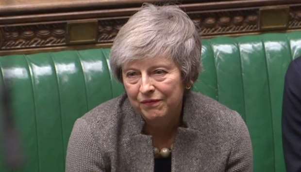 A video grab from footage broadcast by the UK Parliament's Parliamentary Recording Unit (PRU) shows Britain's Prime Minister Theresa May (L) listening as opposition Labour Party leader Jeremy Corbyn (not pictured) announces that he will table a motion of no confidence in Theresa May, in the House of Commons in London on December 17, 2018, following her statement on her attendance at an EU Summit last week