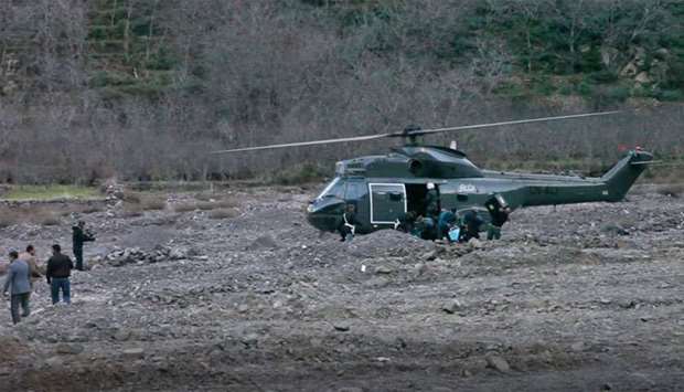 A helicopter at the scene of a crime where the bodies of two Scandinavian women were found the day before in an isolated mountainous area