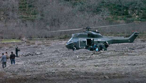 A helicopter at the scene of a crime where the bodies of two Scandinavian women were found the day before in an isolated mountainous area