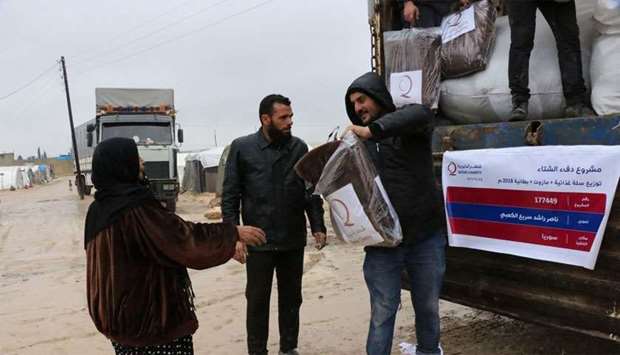 QC distributes winter aid to displaced Syrians
