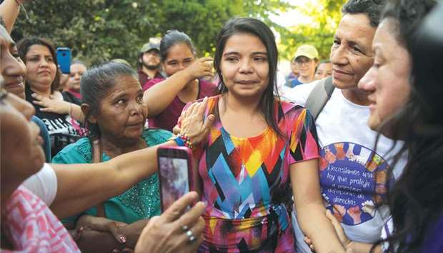 Cortez is accompanied by relatives after she was acquitted and released, outside the Judicial Centre for Sentencing in Usulutan, 90km from San Salvador.