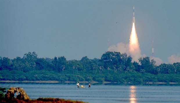 The Indian military communication satellite GSAT-7A is pictured next to the moon as it is launched into orbit on the Indian Space Research Organisation (ISRO)'s Geosynchronous Satellite Launch Vehicle (GSLV) in Sriharikota in the state of Andhra Pradesh