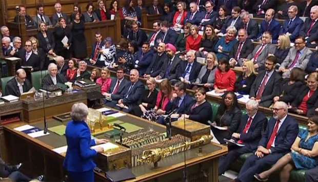 A video grab from footage broadcast by the UK Parliament's Parliamentary Recording Unit (PRU) shows Britain's Prime Minister Theresa May attending the weekly Prime Minister's Questions (PMQs) in the House of Commons in London
