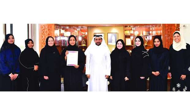 The award-winning Al-Bairaq team members with QU president Dr Hassan Rashid al-Derham