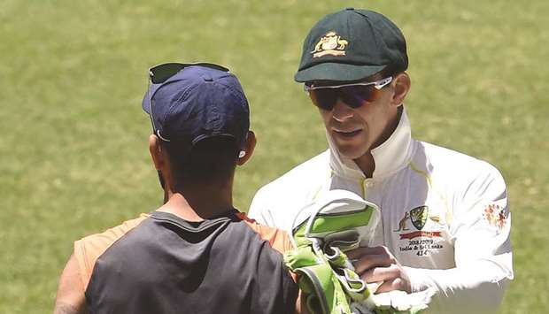 Australiau2019s captain Tim Paine (right) shakes hand with Indian captain Virat Kohli after winning the second Test in Perth on Tuesday. (AFP)