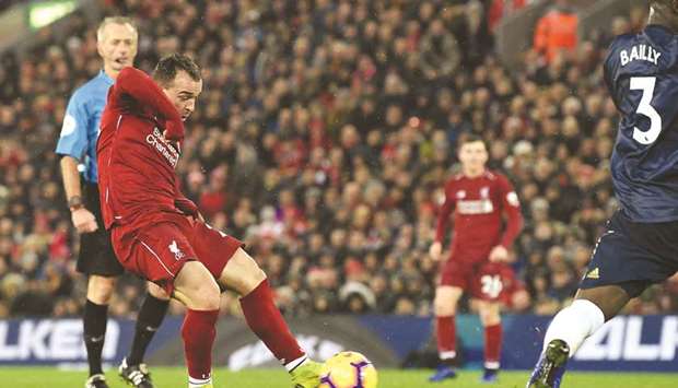 Xherdan Shaqiriu2019s two goals as a substitute on Sunday secured a 3-1 victory over  Manchester United that took Liverpool back to the top of the league. (AFP)