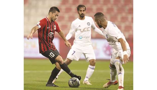 Al Rayyanu2019s Rodrigo Tabata (left) in action against Al Sailiya during their QSL Cup fourth round match at the Al Arabi Stadium yesterday. (Below) Action from the match between Al Sadd (in black) and Al Ahli (in white and blue). (Twitter/QSL)