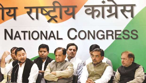 RJD leader Tejashwi Yadav, accompanied by Congress treasurer Ahmed Patel, Rashtriya Lok Samta Party (RLSP) leader Upendra Kushwaha and Loktantrik Janata Dal leader Sharad Yadav, addresses a press conference where Kushwaha, who quit the Modi government this month, joined the United Progressive Alliance (UPA) at the AICC headquarters in New Delhi yesterday.